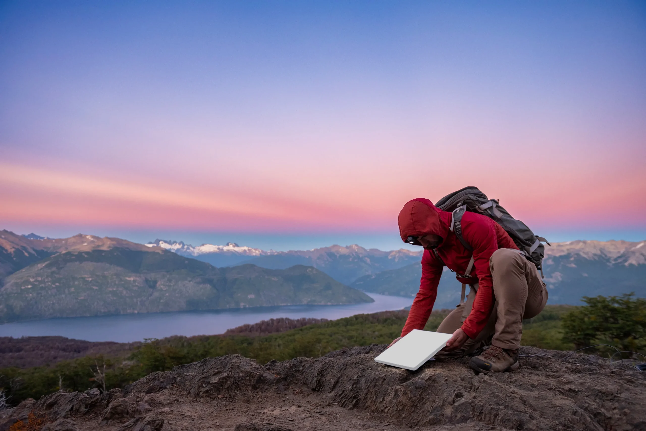 mini backpacker on mountain scaled